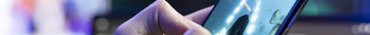 thin banner image showing hand pressing mobile phone screen